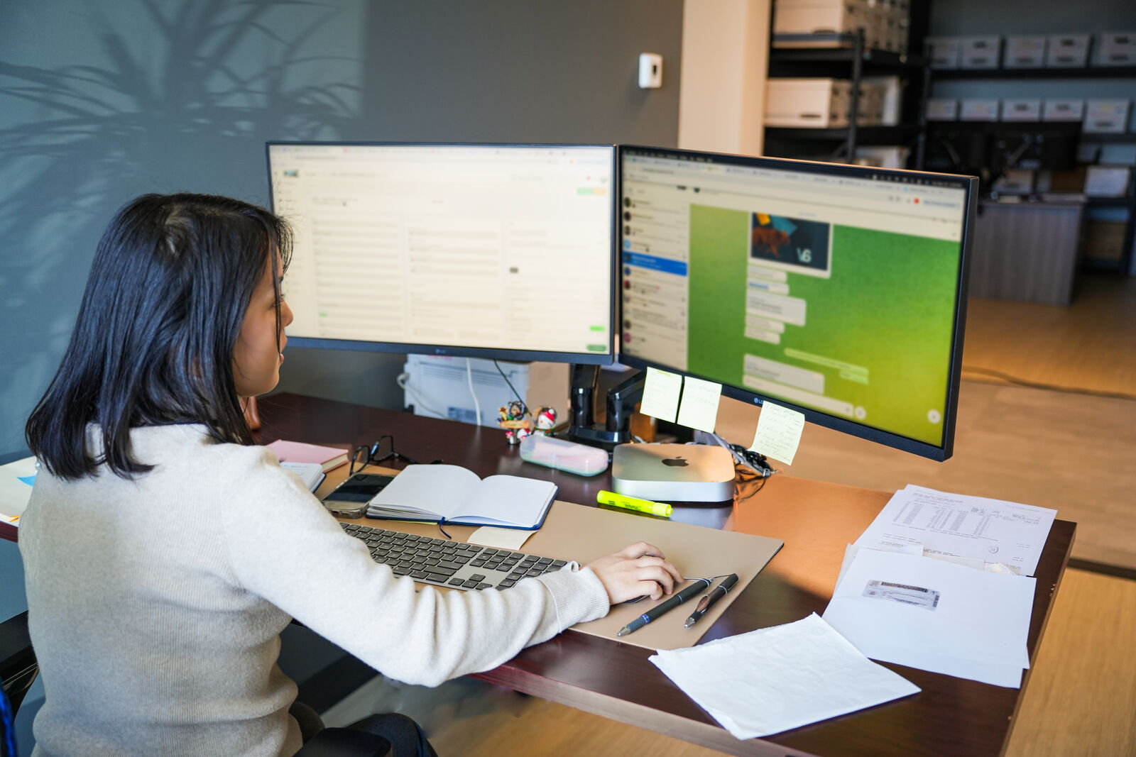 KGZ Transport office staff member at a dual-monitor workstation handling administrative tasks